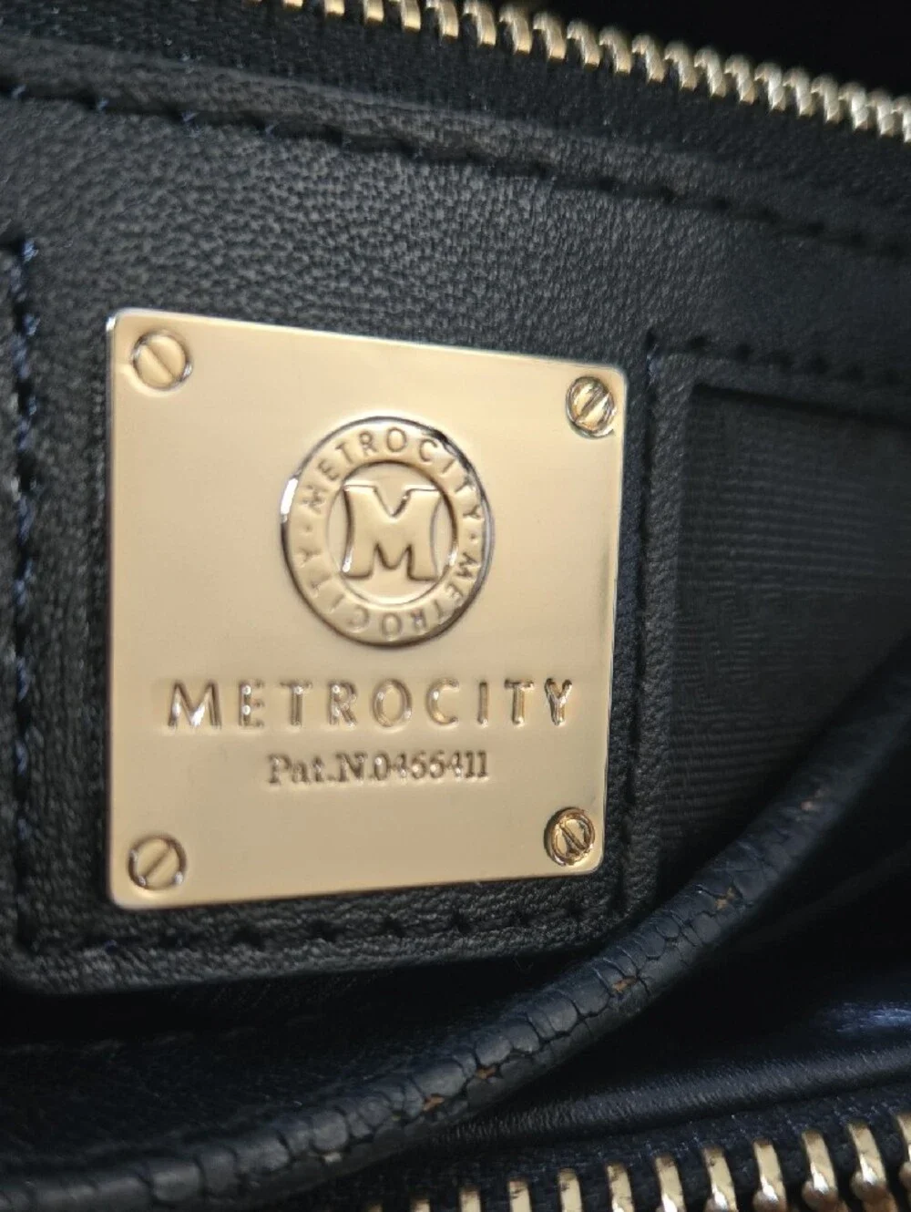 Quilted Black Tote with Gold Medallion Accent